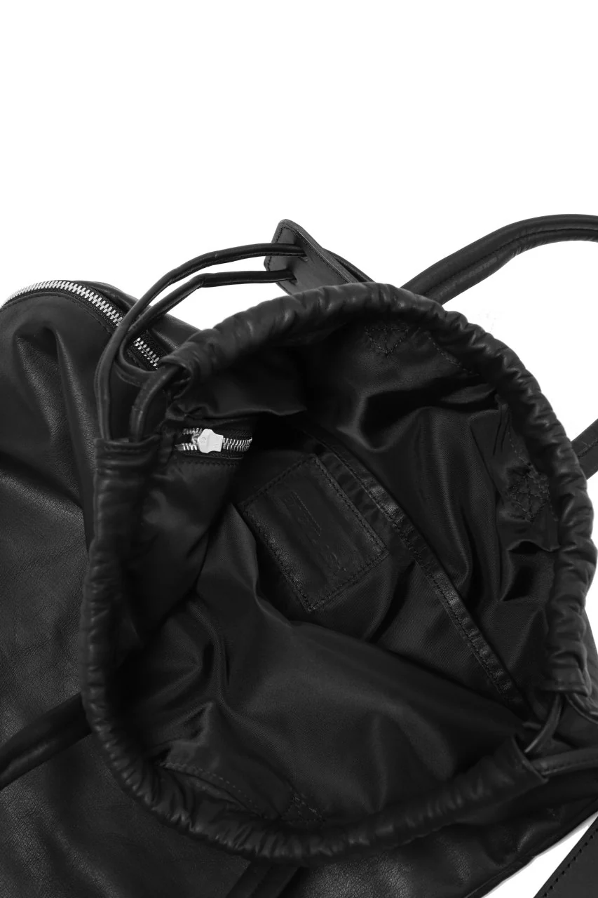 ISAMU KATAYAMA BACKLASH DRAWSTRING BACKPACK / MONOCHROME LUXURY STEER (BLACK) - Image 19